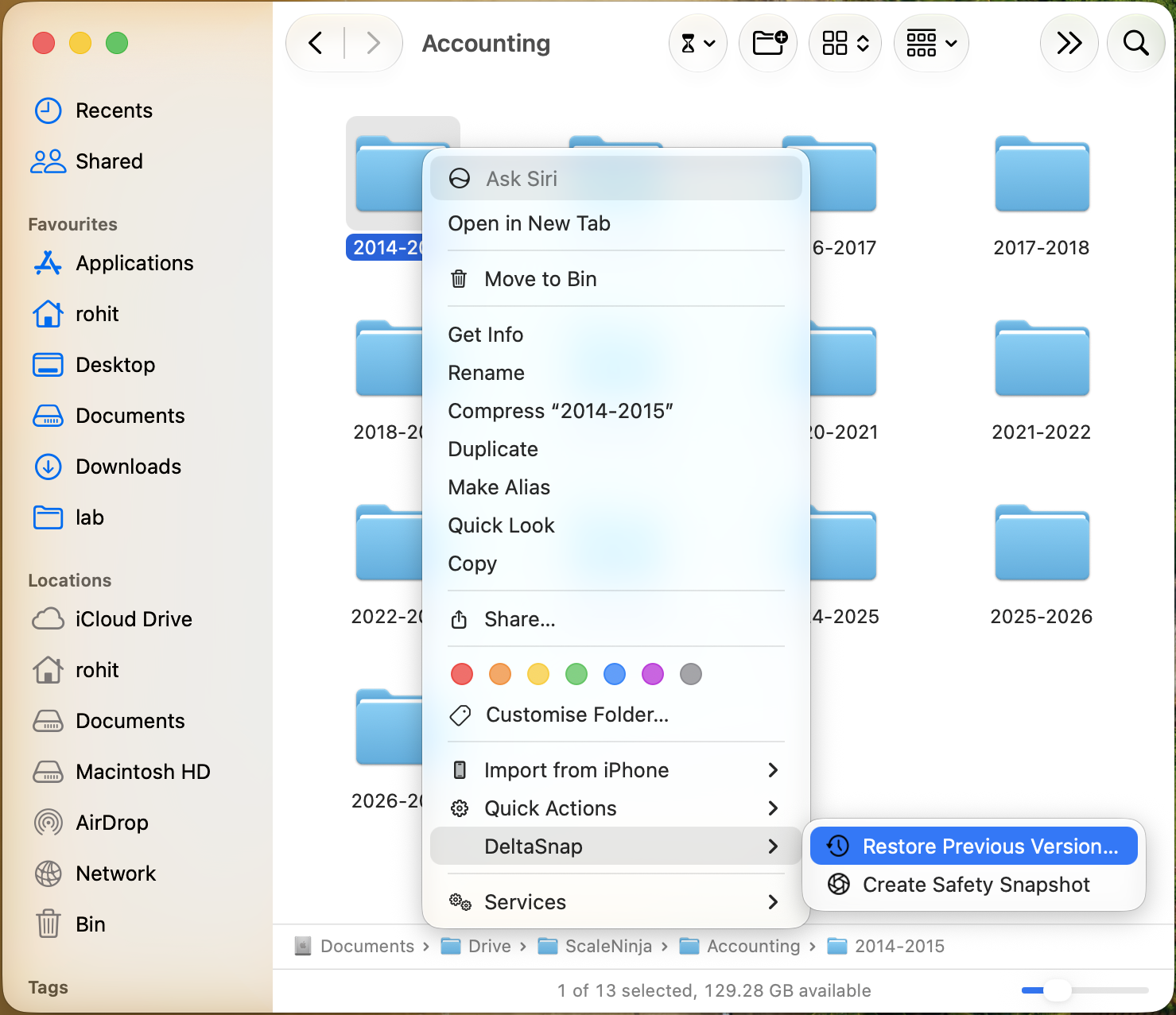 Finder right-click menu with the DeltaSnap submenu open, showing Restore Previous Version and Create Safety Snapshot