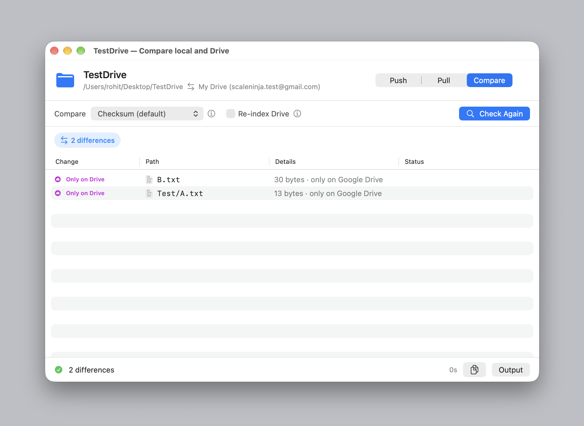 The compare window listing two files that exist only on Google Drive.